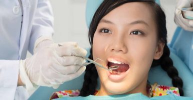 Image of a female young patient in the dental clinic