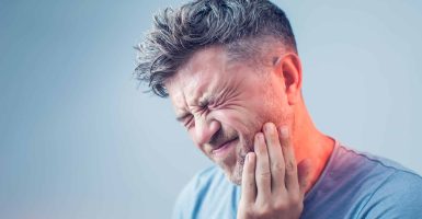 Toothache, medicine, health care concept, Teeth Problem, young man suffering from tooth pain, caries
